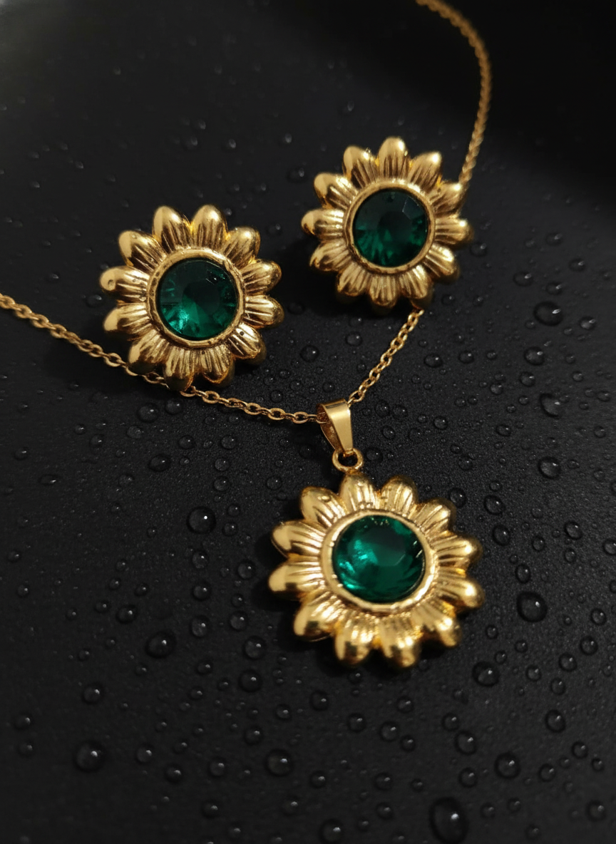 gold-toned sunflower pendant necklace and earrings set with green stone