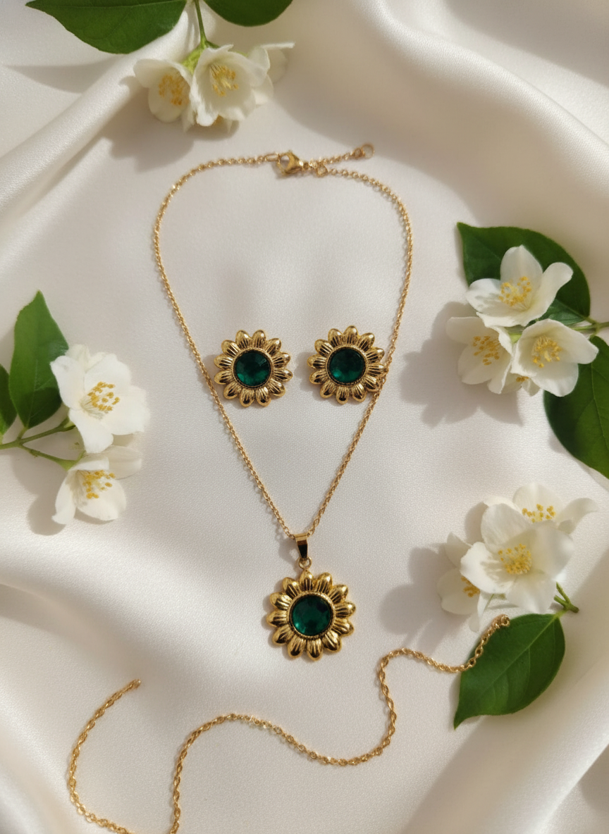 gold-toned sunflower pendant necklace and earrings set with green stone